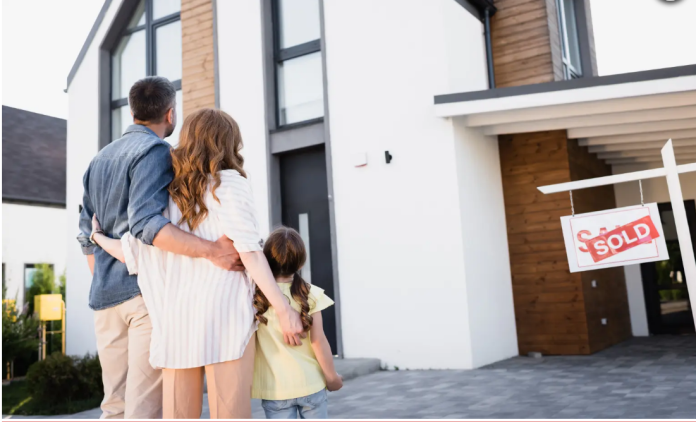 Couple Looking At House