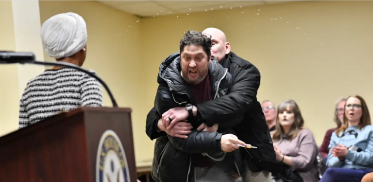 Rep. Ilhan Omar Attacked By Woman Beater Incel At Townhall.