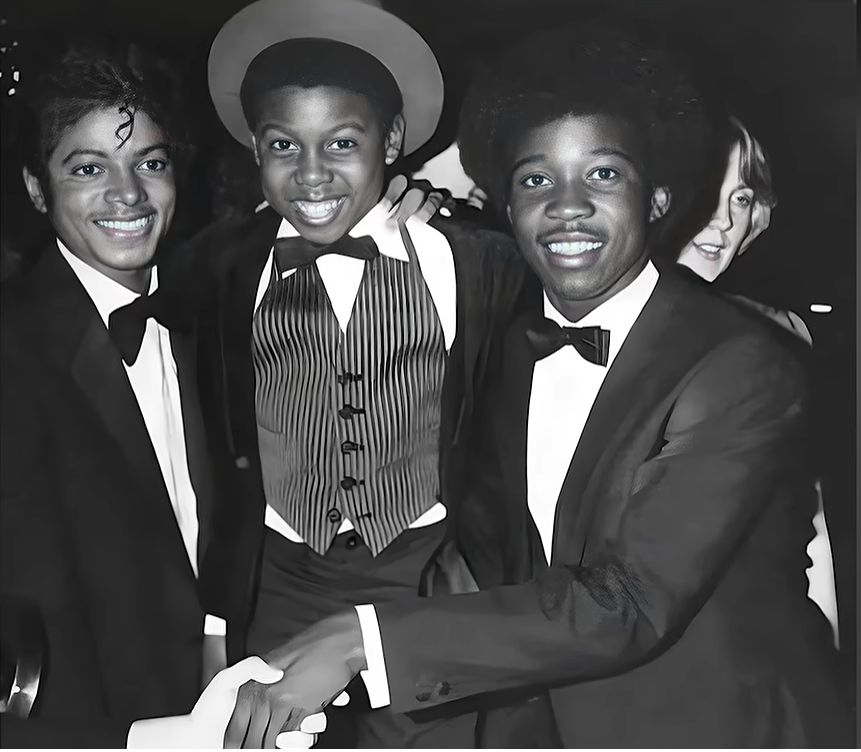 Four Friends in Tuxedos and a Striped Vest Smile at the Camera at a Black-tie Event, Posed Together. Four Friends in Tuxedos and a Striped Vest Smile at the Camera at a Black-tie Event, Posed Together. Four Friends in Tuxedos and a Striped Vest Smile at the Camera at a Black-tie Event, Posed Together. Four Friends in Tuxedos and a Striped Vest Smile at the Camera at a Black-tie Event, Posed Together.